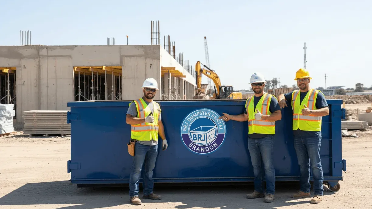 Construction debris disposal in Florida — mixed building waste loaded into a roll-off on a Hillsborough site