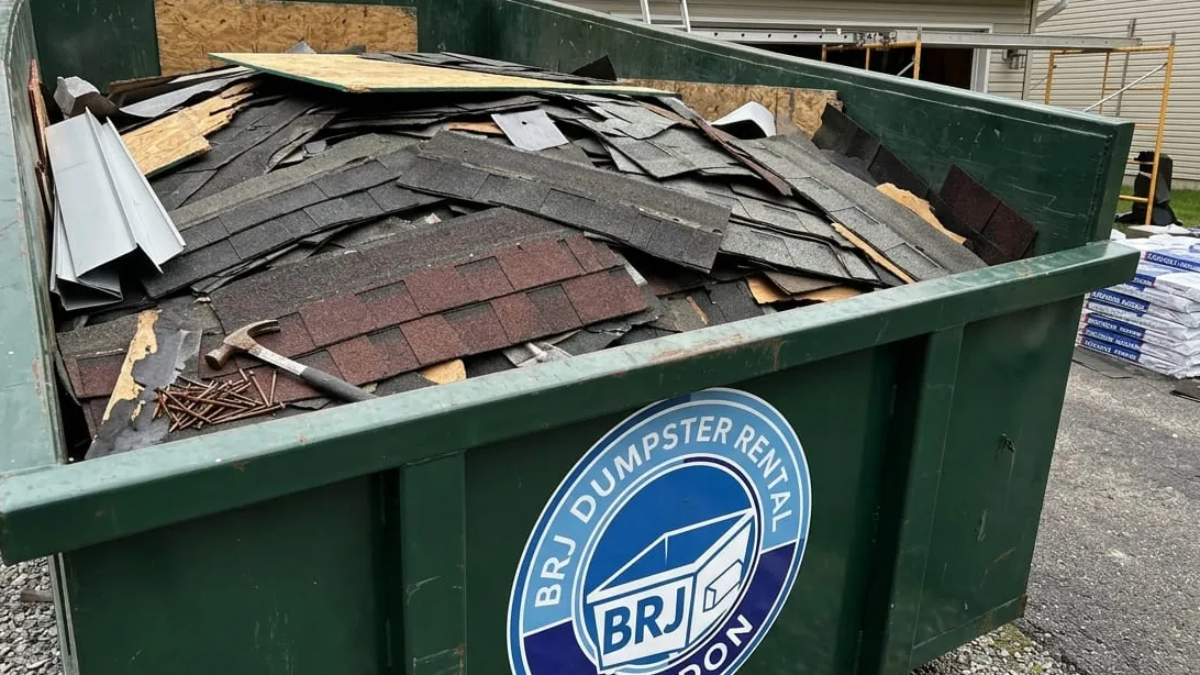 Roofing tear-off dumpster sizing in Brandon, Florida — shingle layers loaded flat by weight, not by volume